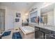 This bathroom features a luxurious soaking tub, dual vanities, granite counters, and a separate shower at 8651 Shadetree St, Huntersville, NC 28078