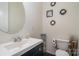 Bathroom featuring a modern sink and vanity with decorative wall art at 8651 Shadetree St, Huntersville, NC 28078