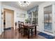 Bright dining area with a wooden table, four chairs, and a large window at 8651 Shadetree St, Huntersville, NC 28078