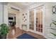 Inviting foyer with hardwood floors and decor, leading to the home's living spaces at 8651 Shadetree St, Huntersville, NC 28078