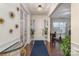 Elegant foyer with hardwood floors, decorative lighting, and a view into the home's living spaces at 8651 Shadetree St, Huntersville, NC 28078