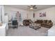 Spacious living room with a large window, plush couches, and patterned ottoman at 8651 Shadetree St, Huntersville, NC 28078