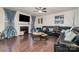 Comfortable living room with a fireplace, hardwood floors, and plenty of seating for relaxation and entertainment at 8651 Shadetree St, Huntersville, NC 28078