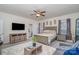 Beautiful main bedroom with a ceiling fan, TV, ensuite bathroom, and a large area rug at 8651 Shadetree St, Huntersville, NC 28078