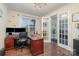Bright home office with french doors, hardwood flooring, and large window at 8651 Shadetree St, Huntersville, NC 28078
