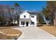 Beautiful two-story home with a new driveway, landscaped front yard, and a covered porch entry at 8705 Moody Rd, Charlotte, NC 28215