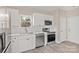 Modern kitchen features stainless appliances, white cabinetry, subway tile backsplash, and a window over the sink at 8705 Moody Rd, Charlotte, NC 28215