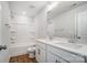 Bright bathroom featuring double sinks, wood-look flooring, and a shower-tub combination at 8720 Acadia Pkwy # 597, Sherrills Ford, NC 28673