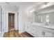 Modern bathroom featuring double sinks, a large mirror and sleek fixtures at 8720 Acadia Pkwy # 597, Sherrills Ford, NC 28673