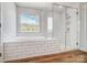 Bathroom showcasing a soaking tub, a glass-enclosed shower, and modern tile work at 8720 Acadia Pkwy # 597, Sherrills Ford, NC 28673