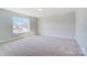 A spacious bedroom with neutral carpet, a large window, and ample natural light at 8720 Acadia Pkwy # 597, Sherrills Ford, NC 28673