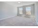 Well-lit bedroom with plush carpet and large windows offering natural light at 8720 Acadia Pkwy # 597, Sherrills Ford, NC 28673