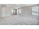 Spacious bonus room featuring neutral walls and plush carpet, perfect for relaxing and entertaining at 8720 Acadia Pkwy # 597, Sherrills Ford, NC 28673