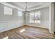 Bright dining room featuring wood floors, chandelier, and wainscoting detail at 8720 Acadia Pkwy # 597, Sherrills Ford, NC 28673