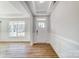 Bright foyer with white trim, wood floors, and a large window offering lots of natural light at 8720 Acadia Pkwy # 597, Sherrills Ford, NC 28673