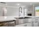 A close up of a kitchen island featuring a stainless steel sink with a modern faucet at 8720 Acadia Pkwy # 597, Sherrills Ford, NC 28673