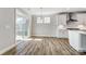 Open kitchen and dining area with stainless steel appliances and white cabinets at 8720 Acadia Pkwy # 597, Sherrills Ford, NC 28673