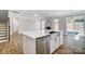 A kitchen island featuring a stainless steel sink and dishwasher in a well-lit, modern space at 8720 Acadia Pkwy # 597, Sherrills Ford, NC 28673