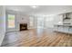Spacious living room with wood floors, a fireplace, and seamlessly connected kitchen, perfect for entertaining at 8720 Acadia Pkwy # 597, Sherrills Ford, NC 28673