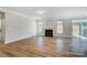 Spacious living room featuring a fireplace, wood floors, and ample natural light from multiple windows at 8720 Acadia Pkwy # 597, Sherrills Ford, NC 28673