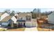 Aerial view of a two-story home with a two-car garage in a residential neighborhood at 9022 Colwick Hill Ln, Charlotte, NC 28215