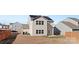 Two-story home with a solar panel roof and a small backyard patio at 9022 Colwick Hill Ln, Charlotte, NC 28215