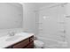 Bright bathroom featuring a tub with shower, vanity with sink, and toilet at 9022 Colwick Hill Ln, Charlotte, NC 28215