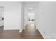 Bright hallway with wood floors leading to the living room at 9022 Colwick Hill Ln, Charlotte, NC 28215