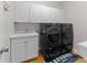 Functional laundry room with new washer and dryer and cabinets at 9181 Fair Oak Dr, Sherrills Ford, NC 28673