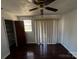 Bedroom with hardwood floors, ceiling fan, blinds and closet at 926 Overhill St, Gastonia, NC 28052