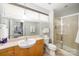 Well-lit bathroom featuring a glass-enclosed shower and neutral countertops at 946 E 8Th St, Charlotte, NC 28204