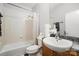 Functional bathroom with a combined tub and shower and traditional vanity at 946 E 8Th St, Charlotte, NC 28204