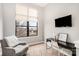 Bright bedroom featuring a neutral color scheme, a large window, and a desk at 946 E 8Th St, Charlotte, NC 28204