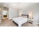 Bright bedroom featuring soft carpet, a queen-size bed, and minimalist decor at 946 E 8Th St, Charlotte, NC 28204