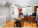 Charming kitchen features a granite island, stainless steel appliances, and a hanging pot rack at 946 E 8Th St, Charlotte, NC 28204
