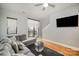 Living room view highlighting hardwood floors, balcony access, and grey walls at 946 E 8Th St, Charlotte, NC 28204