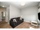 The living room includes a comfortable couch and cozy carpeting at 946 E 8Th St, Charlotte, NC 28204