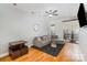 Spacious living room featuring hardwood floors, balcony access, modern furnishings and grey walls at 946 E 8Th St, Charlotte, NC 28204