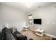 The living room is complete with carpeting, sofa and large windows at 946 E 8Th St, Charlotte, NC 28204