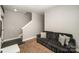 Neutral color scheme, carpeting and couch create inviting space at 946 E 8Th St, Charlotte, NC 28204