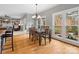 Bright dining room with hardwood floors, chandelier, and large windows with backyard views at 9743 Aegean Ct, Huntersville, NC 28078