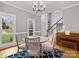 Inviting dining room with views of foyer and a modern chandelier at 9743 Aegean Ct, Huntersville, NC 28078