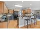 Large kitchen with a breakfast bar, ample cabinet space, granite countertops, and modern appliances at 9743 Aegean Ct, Huntersville, NC 28078