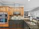 Gourmet kitchen with stainless steel appliances, granite countertops, and a modern cooktop at 9743 Aegean Ct, Huntersville, NC 28078