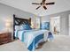 Inviting main bedroom features a large bed with blue accents and adjoining bathroom at 9743 Aegean Ct, Huntersville, NC 28078
