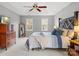 Bright main bedroom boasts a tray ceiling, a large bed, and lots of natural light at 9743 Aegean Ct, Huntersville, NC 28078