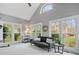Sun-drenched sitting room with vaulted ceilings and views of the landscaped backyard at 9743 Aegean Ct, Huntersville, NC 28078