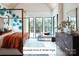 Bright and airy bedroom featuring modern decor, a large bed, and a view of the backyard at Lot 4 Holbrook Rd, Fort Mill, SC 29715