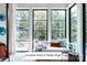Bedroom with a view of the pool area from the seating area in front of the black framed windows at Lot 4 Holbrook Rd, Fort Mill, SC 29715