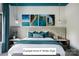 Serene main bedroom featuring coastal artwork, plush bedding, and stylish lighting at Lot 4 Holbrook Rd, Fort Mill, SC 29715
